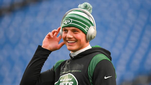 New York Jets QB Zach Wilson smiles during pregame workout